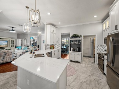 STUNNING CURB APPEAL on this GORGEOUS FULLY REMODELED PANORAMIC on Tampa Bay Golf and Country Club in Florida - for sale on GolfHomes.com, golf home, golf lot