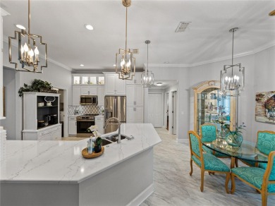 STUNNING CURB APPEAL on this GORGEOUS FULLY REMODELED PANORAMIC on Tampa Bay Golf and Country Club in Florida - for sale on GolfHomes.com, golf home, golf lot