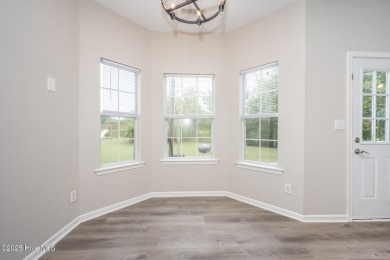 Welcome Home! This beautiful 4-bedroom, 2.5-bath home offers on Eagle Creek Golf Club and Grill in North Carolina - for sale on GolfHomes.com, golf home, golf lot
