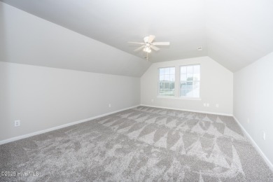 Welcome Home! This beautiful 4-bedroom, 2.5-bath home offers on Eagle Creek Golf Club and Grill in North Carolina - for sale on GolfHomes.com, golf home, golf lot