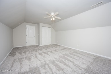 Welcome Home! This beautiful 4-bedroom, 2.5-bath home offers on Eagle Creek Golf Club and Grill in North Carolina - for sale on GolfHomes.com, golf home, golf lot