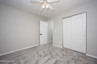 Welcome Home! This beautiful 4-bedroom, 2.5-bath home offers on Eagle Creek Golf Club and Grill in North Carolina - for sale on GolfHomes.com, golf home, golf lot