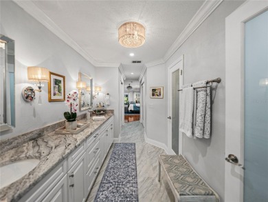 STUNNING CURB APPEAL on this GORGEOUS FULLY REMODELED PANORAMIC on Tampa Bay Golf and Country Club in Florida - for sale on GolfHomes.com, golf home, golf lot