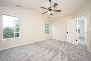 Welcome Home! This beautiful 4-bedroom, 2.5-bath home offers on Eagle Creek Golf Club and Grill in North Carolina - for sale on GolfHomes.com, golf home, golf lot