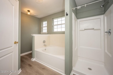 Welcome Home! This beautiful 4-bedroom, 2.5-bath home offers on Eagle Creek Golf Club and Grill in North Carolina - for sale on GolfHomes.com, golf home, golf lot