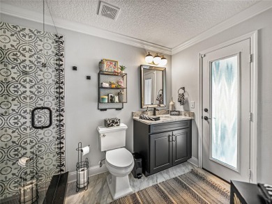 STUNNING CURB APPEAL on this GORGEOUS FULLY REMODELED PANORAMIC on Tampa Bay Golf and Country Club in Florida - for sale on GolfHomes.com, golf home, golf lot