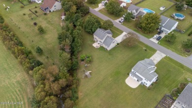 Welcome Home! This beautiful 4-bedroom, 2.5-bath home offers on Eagle Creek Golf Club and Grill in North Carolina - for sale on GolfHomes.com, golf home, golf lot
