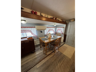 Cleared lot with camper with addition.  Lot is fully stoned...NO on Captains Cove Golf and Yacht Club in Virginia - for sale on GolfHomes.com, golf home, golf lot