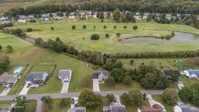 Welcome Home! This beautiful 4-bedroom, 2.5-bath home offers on Eagle Creek Golf Club and Grill in North Carolina - for sale on GolfHomes.com, golf home, golf lot