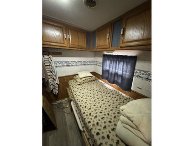 Cleared lot with camper with addition.  Lot is fully stoned...NO on Captains Cove Golf and Yacht Club in Virginia - for sale on GolfHomes.com, golf home, golf lot