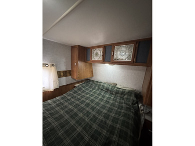 Cleared lot with camper with addition.  Lot is fully stoned...NO on Captains Cove Golf and Yacht Club in Virginia - for sale on GolfHomes.com, golf home, golf lot