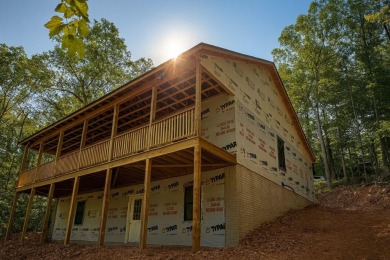 Nestled on 0.6 wooded acres in Bryce Resort, 125 Crab Apple Rd on Bryce Resort Golf Course in Virginia - for sale on GolfHomes.com, golf home, golf lot