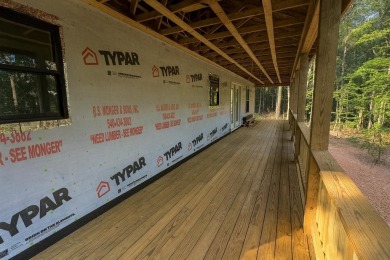 Nestled on 0.6 wooded acres in Bryce Resort, 125 Crab Apple Rd on Bryce Resort Golf Course in Virginia - for sale on GolfHomes.com, golf home, golf lot