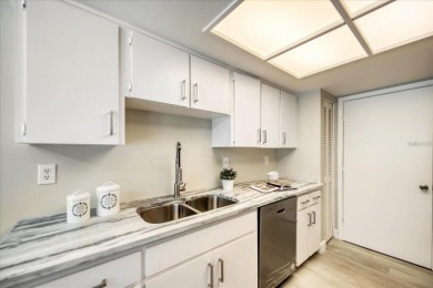 Beautifully renovated villa with private backyard view in Sutton on Highland Lakes Executive Golf Course in Florida - for sale on GolfHomes.com, golf home, golf lot