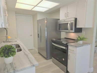 Beautifully renovated villa with private backyard view in Sutton on Highland Lakes Executive Golf Course in Florida - for sale on GolfHomes.com, golf home, golf lot