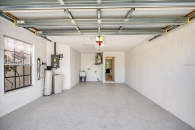 Beautifully renovated villa with private backyard view in Sutton on Highland Lakes Executive Golf Course in Florida - for sale on GolfHomes.com, golf home, golf lot