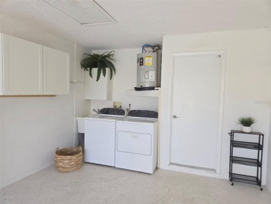 Beautifully renovated villa with private backyard view in Sutton on Highland Lakes Executive Golf Course in Florida - for sale on GolfHomes.com, golf home, golf lot