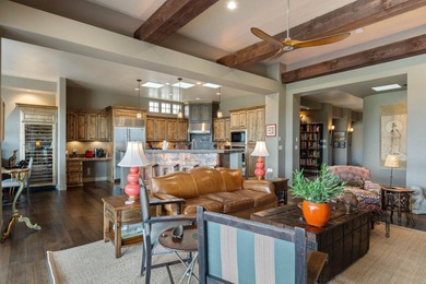 This elegant home sits on the Entrada Fairway with large windows on Entrada at Snow Canyon in Utah - for sale on GolfHomes.com, golf home, golf lot