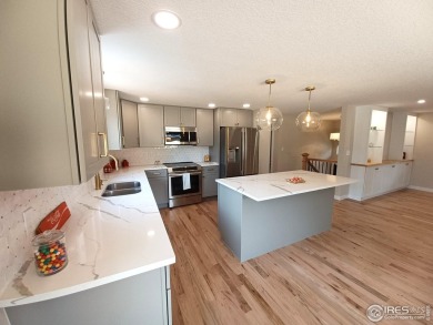 Location, views and updated finishes, this home has it all! on Sunset Golf Course in Colorado - for sale on GolfHomes.com, golf home, golf lot