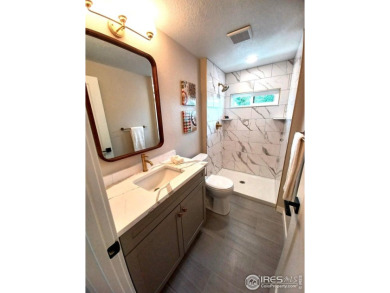 Location, views and updated finishes, this home has it all! on Sunset Golf Course in Colorado - for sale on GolfHomes.com, golf home, golf lot