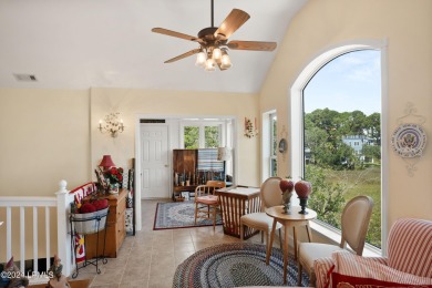 Gorgeous custom built home with enchanting marsh views. Walk to on Ocean Creek Golf Course in South Carolina - for sale on GolfHomes.com, golf home, golf lot