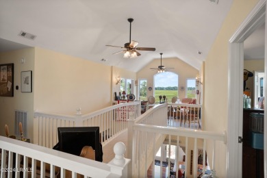 Gorgeous custom built home with enchanting marsh views. Walk to on Ocean Creek Golf Course in South Carolina - for sale on GolfHomes.com, golf home, golf lot