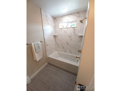 Location, views and updated finishes, this home has it all! on Sunset Golf Course in Colorado - for sale on GolfHomes.com, golf home, golf lot