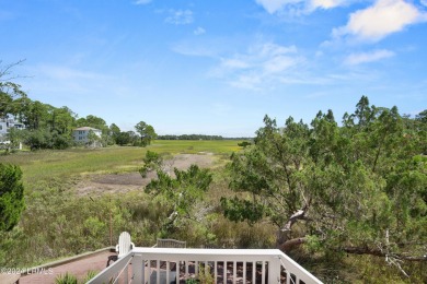 Gorgeous custom built home with enchanting marsh views. Walk to on Ocean Creek Golf Course in South Carolina - for sale on GolfHomes.com, golf home, golf lot