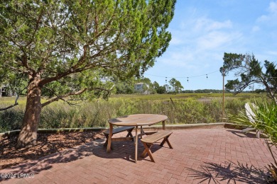 Gorgeous custom built home with enchanting marsh views. Walk to on Ocean Creek Golf Course in South Carolina - for sale on GolfHomes.com, golf home, golf lot