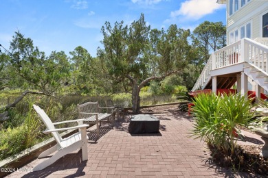 Gorgeous custom built home with enchanting marsh views. Walk to on Ocean Creek Golf Course in South Carolina - for sale on GolfHomes.com, golf home, golf lot