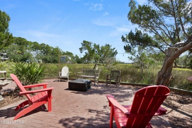 Gorgeous custom built home with enchanting marsh views. Walk to on Ocean Creek Golf Course in South Carolina - for sale on GolfHomes.com, golf home, golf lot