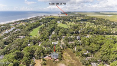 Gorgeous custom built home with enchanting marsh views. Walk to on Ocean Creek Golf Course in South Carolina - for sale on GolfHomes.com, golf home, golf lot