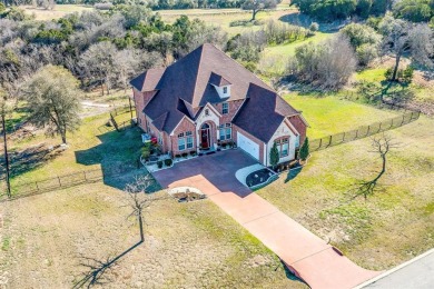 This beautiful custom home with a view is tucked away in a on The Retreat in Texas - for sale on GolfHomes.com, golf home, golf lot