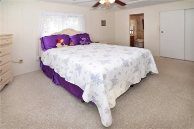 Immaculate, Impeccably maintained, welcoming home with on Barefoot Bay Golf Course in Florida - for sale on GolfHomes.com, golf home, golf lot