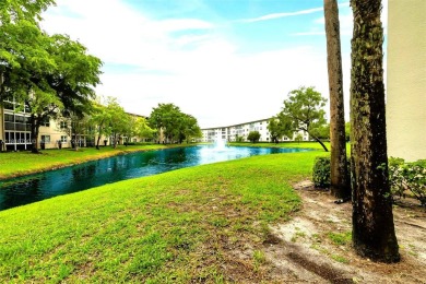 Rarely available CORNER UNIT on the water. Stunning and freshly on Wynmoor Golf Course in Florida - for sale on GolfHomes.com, golf home, golf lot