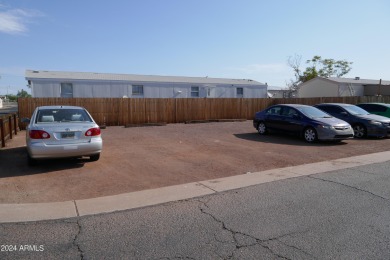 Move-in ready and spacious, this multi-wide home in Shamrock on Desert Mirage Golf Course in Arizona - for sale on GolfHomes.com, golf home, golf lot