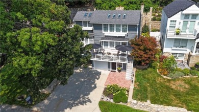 Wake up each day to the peaceful beauty of Lake Quivira in this on Lake Quivira Country Club in Kansas - for sale on GolfHomes.com, golf home, golf lot