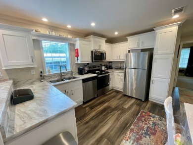 This home has barley been lived in and comes with a Transferable on Water Oak Country Club Estates in Florida - for sale on GolfHomes.com, golf home, golf lot
