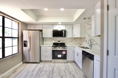 Beautiful Completely remodeled inside of this one level patio on Fountain of the Sun Country Club in Arizona - for sale on GolfHomes.com, golf home, golf lot