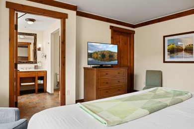 Discover The Lodge at Spruce Peak, the crown jewel of the Alpine on Stowe Mountain Club in Vermont - for sale on GolfHomes.com, golf home, golf lot