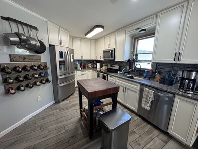 Large home located on an oversized lot in Captain's Cove on Captains Cove Golf and Yacht Club in Virginia - for sale on GolfHomes.com, golf home, golf lot