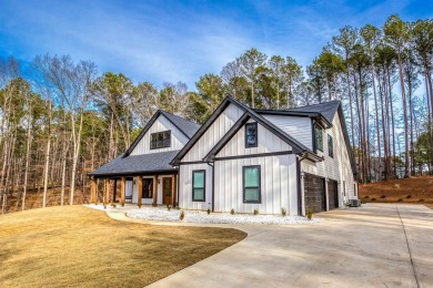 This exquisite custom built home offers 4 spacious bedrooms and on Harbor Club Golf and Country Club in Georgia - for sale on GolfHomes.com, golf home, golf lot