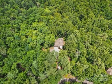 Experience mountain living at its finest in this stunning 4BR/2 on Connestee Falls Golf Club in North Carolina - for sale on GolfHomes.com, golf home, golf lot