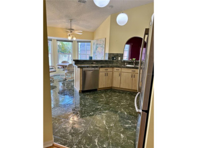 Welcome to a lovely home situated on a large corner lot in the on Caloosa Greens Executive Golf Course in Florida - for sale on GolfHomes.com, golf home, golf lot