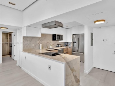 Step into unparalleled elegance with this exquisitely remodeled on Turnberry Isle Resort and Club in Florida - for sale on GolfHomes.com, golf home, golf lot