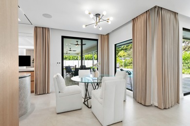 Experience refined luxury in this true designer Smart Home on Pine Tree Golf Club in Florida - for sale on GolfHomes.com, golf home, golf lot