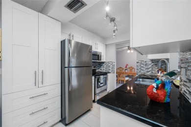 Welcome to this beautifully updated 2BR/2BA/1 car garage Villa on Largo Golf Course in Florida - for sale on GolfHomes.com, golf home, golf lot