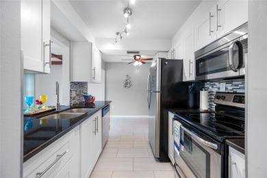 Welcome to this beautifully updated 2BR/2BA/1 car garage Villa on Largo Golf Course in Florida - for sale on GolfHomes.com, golf home, golf lot