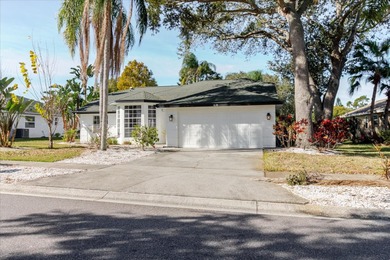 Short Sale. Step into this stunning split-floor plan residence on Tarpon Springs Golf Course in Florida - for sale on GolfHomes.com, golf home, golf lot