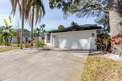 Short Sale. Step into this stunning split-floor plan residence on Tarpon Springs Golf Course in Florida - for sale on GolfHomes.com, golf home, golf lot